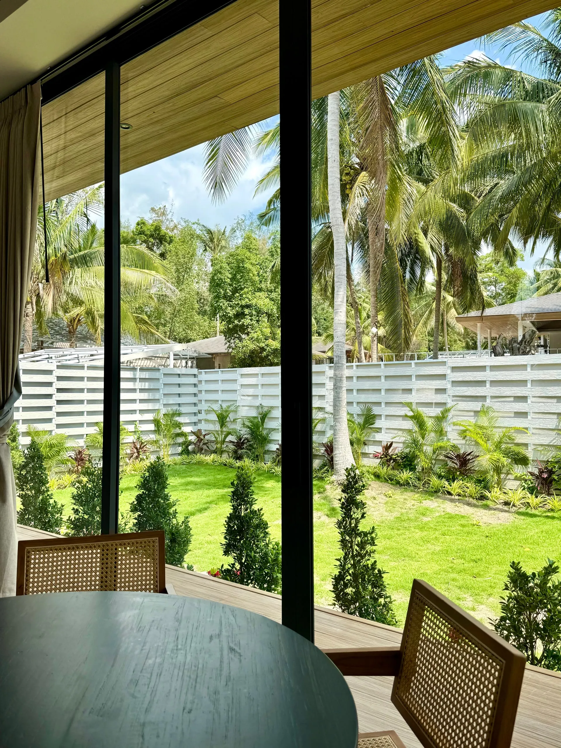 Villa I — garden view from the dining table through panoramic glass