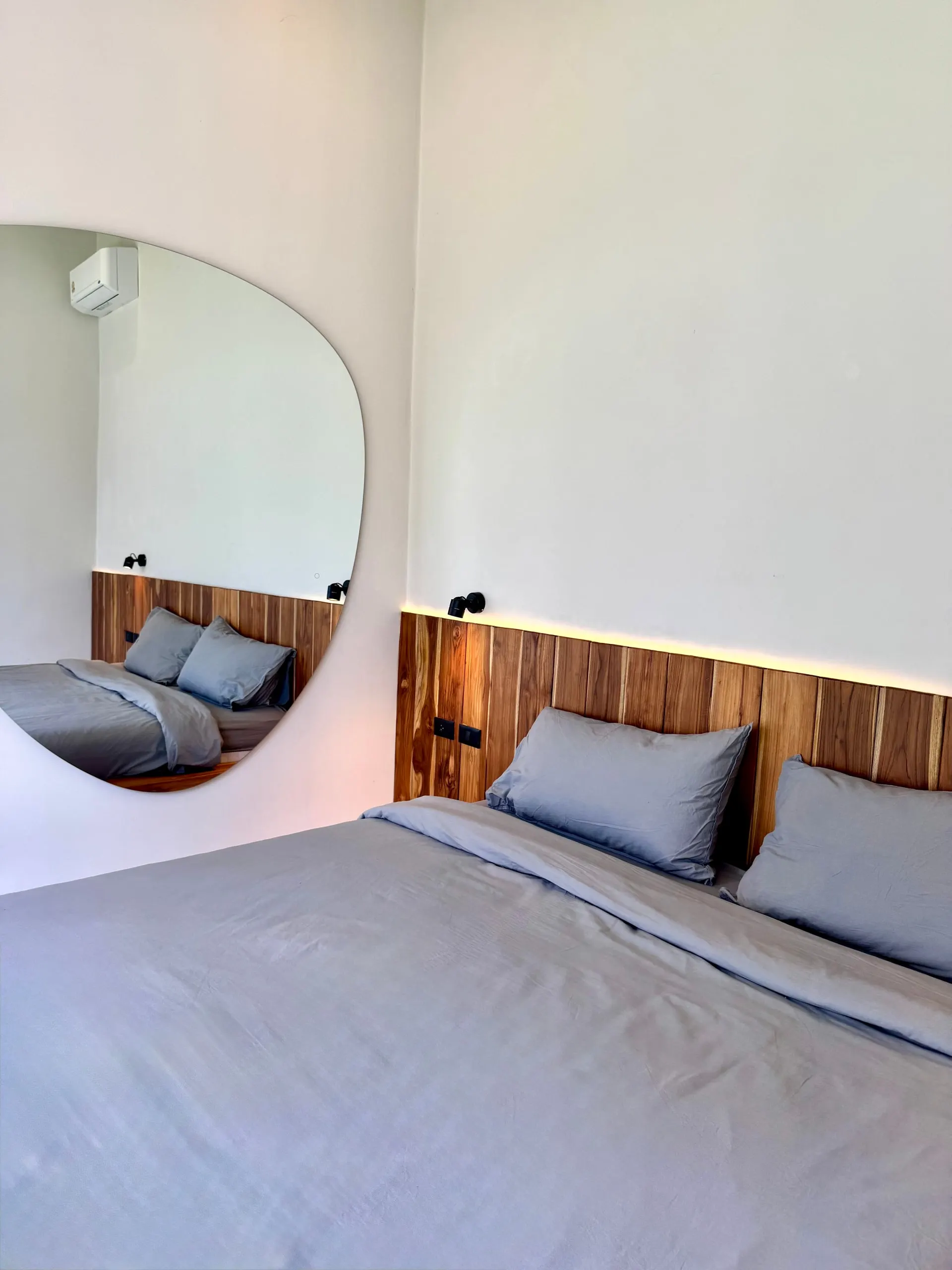 Villa I — bedroom one in calm beige-grey tones