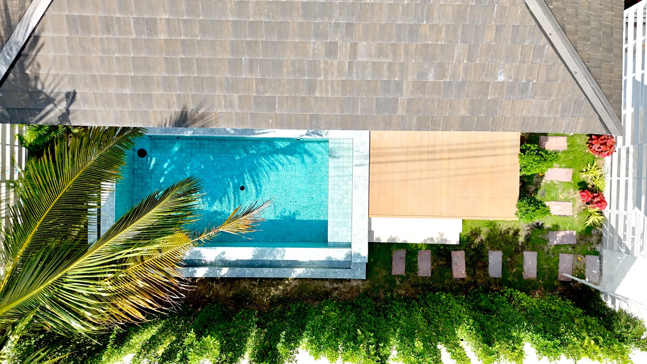 Villa I — drone view of the pool, terrace and shingle roof
