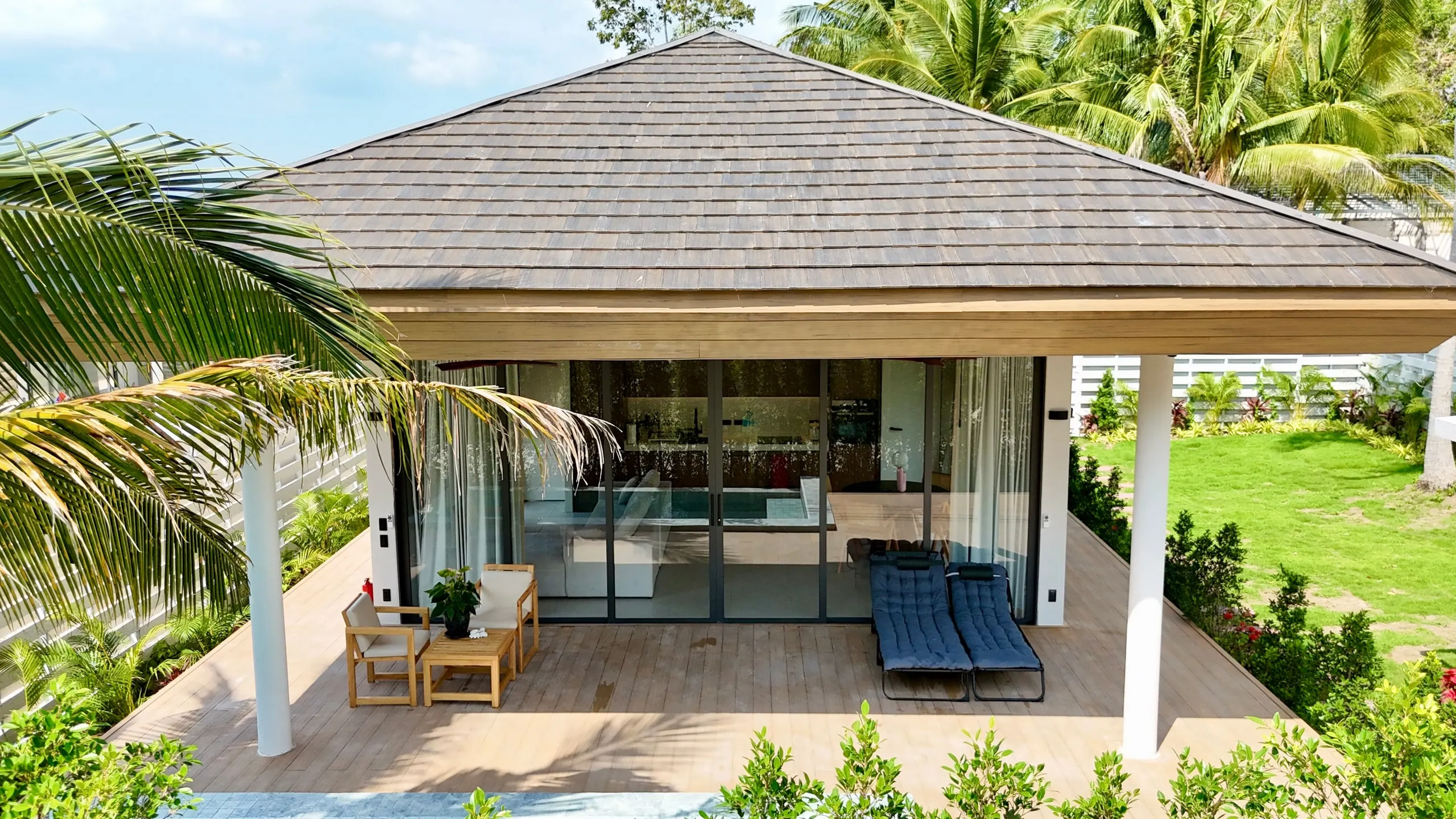 Villa I — villa facade with covered terrace and loungers