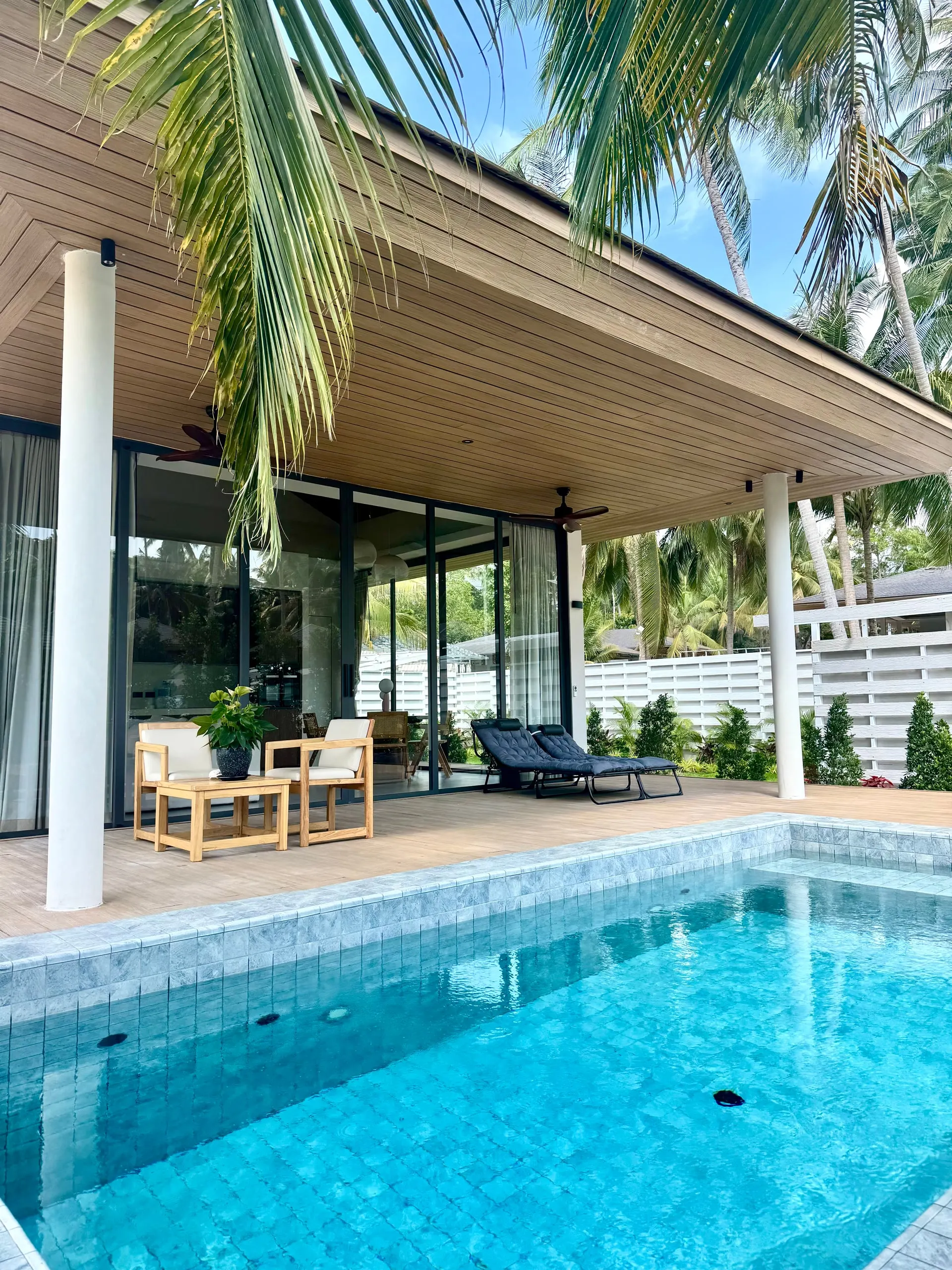 Villa I — bright blue pool by the shaded terrace