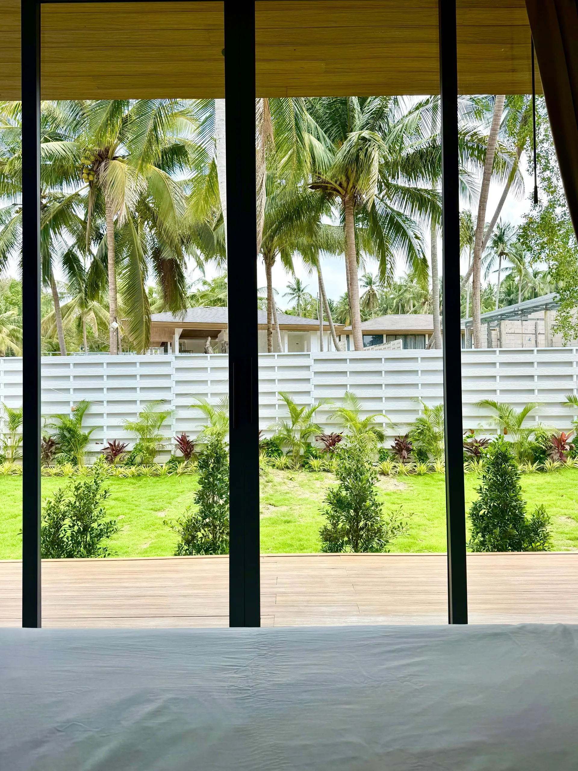 Villa I — garden view through the bedroom’s sliding doors